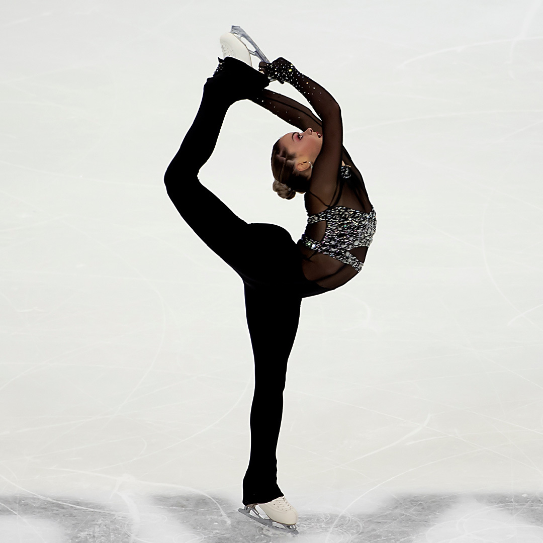 A figure skater wearing a black costume performs a Biellmann spin.