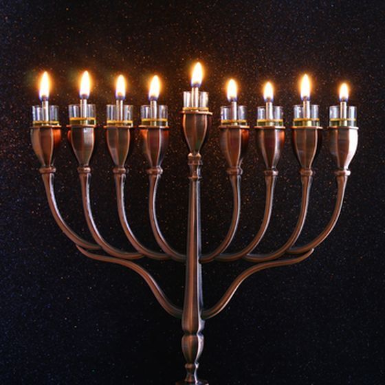 on-the-first-day-of-hanukkah-the-nine-branches-of-a-candleholder-called-the-hanukkiah-also-known-as-a-menorah-are-lit
