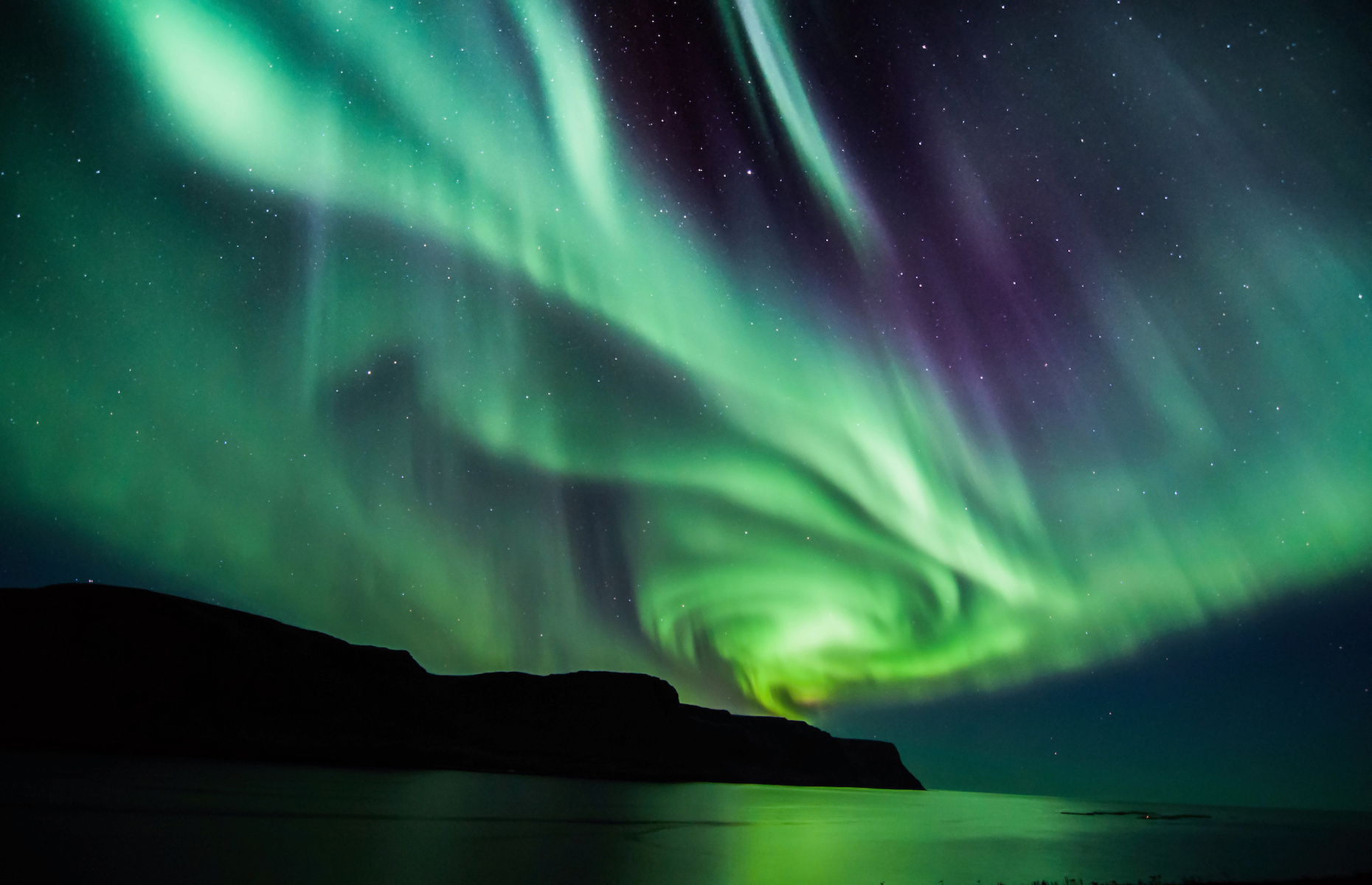 Auroras emerge when moonlight hits certain particles in the air.