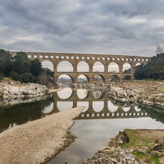 Pont du Gard (France), the world's longest aqueduct bridge, weighs approximately 50,000 metric tons.