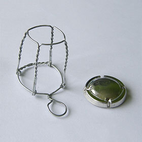 The wire-cap is used for sealing the cork to prevent ambient oxygen from contaminating the champagne.