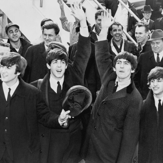 The Beatles released a 45 rpm record that included the songs “Komm, gib mir deine Hand” and “Sie liebt dich.”