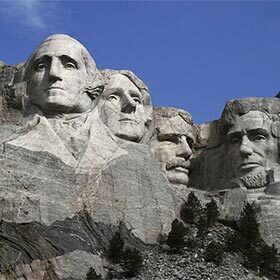 Mount Rushmore is located in the State of Arizona, at the northern end of the Grand Canyon.