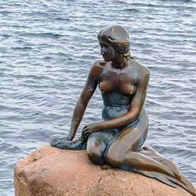 The Little Mermaid is located in the port of Copenhagen.