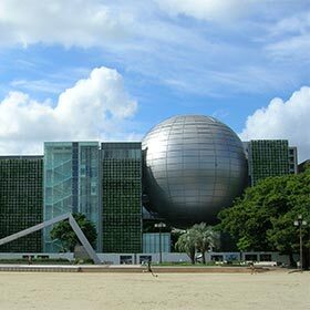 This building, which looks like a ball stuck between two buildings, houses the largest planetarium in the world.