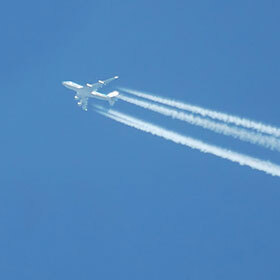 The contrails of airplanes are caused by the cooling of carbon dioxide at high altitude.