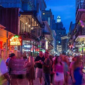 Bourbon Street owes its name to its many bistros that serve bourbon, a type of whiskey made in the United States.
